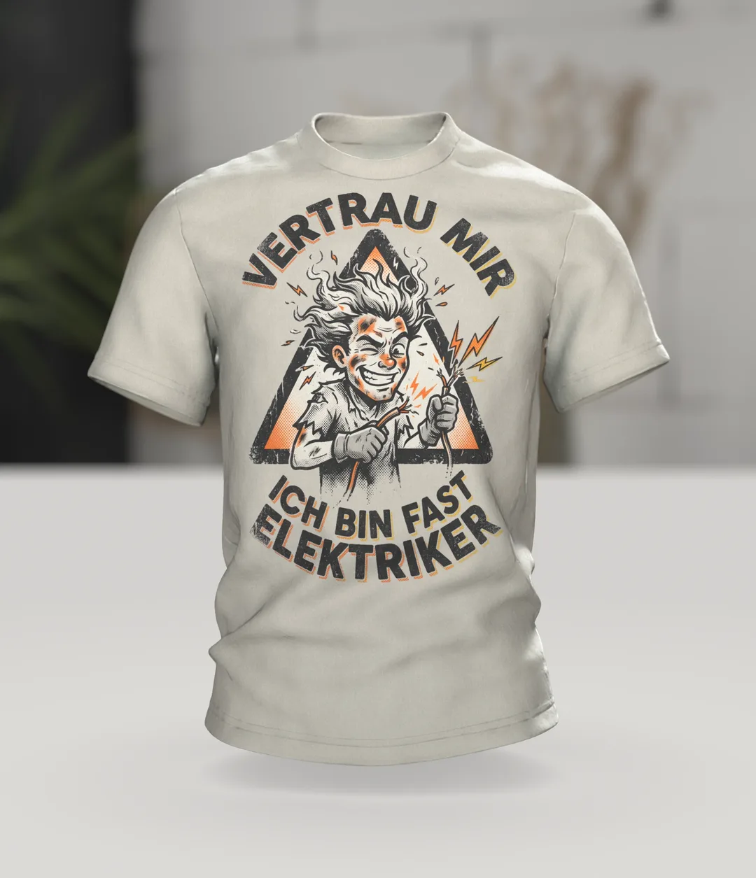Electrician Comic T-shirt "Vertrau mir, ich bin fast Elektriker", Singed Hero in a Warning Triangle, In context